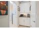 Practical mudroom with storage cabinets and laundry area at 2554 Stargrass Cir, Clermont, FL 34715