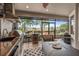 Relaxing covered lanai includes outdoor kitchen, bar-height seating and open-air seating area at 2554 Stargrass Cir, Clermont, FL 34715