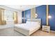 Cozy bedroom boasts a comfortable bed, stylish decor, and a bright window with views of the outdoors at 266 Marcello Blvd, Kissimmee, FL 34746