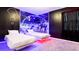 Themed bedroom with twin beds, Star Wars wall art, and unique lighting that creates an out-of-this-world experience at 266 Marcello Blvd, Kissimmee, FL 34746