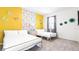 Warm and inviting bedroom features two beds, bright wall, and ample natural light, perfect for relaxing and unwinding at 266 Marcello Blvd, Kissimmee, FL 34746