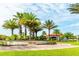 Welcome to Bella Vida, featuring lush landscaping, a beautiful entrance sign, and towering palm trees at 266 Marcello Blvd, Kissimmee, FL 34746