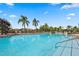 Enjoy the outdoors at this stunning community pool surrounded by plenty of lounge chairs and swaying palm trees at 266 Marcello Blvd, Kissimmee, FL 34746