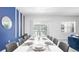 Bright dining room with large table, stylish decor, and a view of the outdoor pool area at 266 Marcello Blvd, Kissimmee, FL 34746