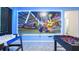 Bright, spacious game room with air hockey, foosball, and a wall-sized Mario Kart mural for endless Gathering fun at 266 Marcello Blvd, Kissimmee, FL 34746