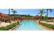 Community pool with cabanas, surrounded by lush landscaping in a resort-style setting at 266 Marcello Blvd, Kissimmee, FL 34746