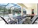 Covered patio overlooking a private pool, perfect for outdoor relaxation and entertaining at 266 Marcello Blvd, Kissimmee, FL 34746