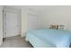 Comfortable bedroom with a closet and a sunny window featuring relaxing natural light at 2701 Sw 153Rd Ln, Ocala, FL 34473