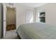Neutral bedroom with a modern wood floor, a soft queen bed, and a large closet for storage at 2701 Sw 153Rd Ln, Ocala, FL 34473