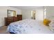 Bedroom showcasing a cozy bed with decorative pillows and ocean-themed bedding and natural light at 2701 Sw 153Rd Ln, Ocala, FL 34473