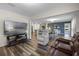 Open-concept living area, with hardwood floors, seamless to the kitchen and dining room, and comfortable seating at 2701 Sw 153Rd Ln, Ocala, FL 34473