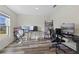 Spacious office includes multiple monitors, a bookshelf, and stylish wood-look flooring at 2701 Sw 153Rd Ln, Ocala, FL 34473