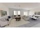 Bright living room featuring contemporary furnishings, neutral tones, and ample natural light at 3041 Daffodil Dr, Lake Hamilton, FL 33851