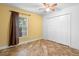 Bedroom with a window and a double door closet at 305 Grande Lake Dr, Daytona Beach, FL 32124