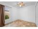 Bedroom featuring a window at 305 Grande Lake Dr, Daytona Beach, FL 32124