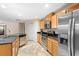 Kitchen with stainless steel appliances, granite countertops, and tile floors at 305 Grande Lake Dr, Daytona Beach, FL 32124