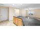 Kitchen island with granite countertops and stainless steel sink at 305 Grande Lake Dr, Daytona Beach, FL 32124
