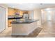 Spacious kitchen island with granite countertops, stainless steel appliances, and ample cabinet space at 305 Grande Lake Dr, Daytona Beach, FL 32124
