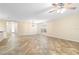 Open-concept living room with tile floors, recessed lighting, and ceiling fan at 305 Grande Lake Dr, Daytona Beach, FL 32124
