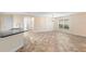 Bright living room with tile flooring, neutral walls, and ample natural light from a large window at 305 Grande Lake Dr, Daytona Beach, FL 32124