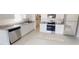 Modern kitchen with stainless steel appliances, granite countertops, and ample cabinet space at 3079 Sunset Hills Rd, Winter Haven, FL 33881