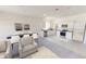 Open-concept living space featuring modern furnishings and a seamless flow to the kitchen at 3079 Sunset Hills Rd, Winter Haven, FL 33881