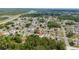Aerial view of a residential community showcasing the property's location with lush greenery and neighborhood streets at 313 Greenwich Ct, Kissimmee, FL 34758