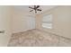Comfortable bedroom featuring tile floors, a ceiling fan, a window and a closet for ample storage space at 313 Greenwich Ct, Kissimmee, FL 34758