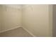 Walk-in closet featuring wire shelving and tile flooring for optimal organization and storage at 313 Greenwich Ct, Kissimmee, FL 34758