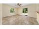 Dining room with tile floors, a ceiling fan, a bright window, and sliding doors to the backyard at 313 Greenwich Ct, Kissimmee, FL 34758
