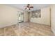 Inviting living room features tile floors, sliding glass door to the backyard, and an open layout to the kitchen at 313 Greenwich Ct, Kissimmee, FL 34758