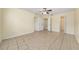 Spacious main bedroom with tile floors and direct access to the ensuite bathroom and walk-in closet at 313 Greenwich Ct, Kissimmee, FL 34758