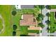 Aerial view of a well-maintained home with a spacious driveway and lush green lawn at 31754 Red Tail Blvd, Sorrento, FL 32776