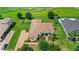 Beautiful aerial view of home with lush landscaping, a paver driveway, and a well-maintained lawn at 31754 Red Tail Blvd, Sorrento, FL 32776