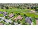 Aerial view of homes backing onto a golf course, showcasing scenic views and a desirable neighborhood at 31754 Red Tail Blvd, Sorrento, FL 32776