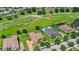 Aerial view of homes backing onto a golf course, showcasing scenic views and a desirable neighborhood at 31754 Red Tail Blvd, Sorrento, FL 32776