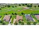 Aerial view of homes backing onto a golf course, showcasing scenic views and a desirable neighborhood at 31754 Red Tail Blvd, Sorrento, FL 32776