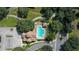 Aerial view of the community pool with ample seating and lush landscaping in a resort-style setting at 31754 Red Tail Blvd, Sorrento, FL 32776