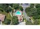 Aerial view of the community pool with ample seating and lush landscaping in a resort-style setting at 31754 Red Tail Blvd, Sorrento, FL 32776