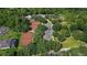 Aerial view of tennis courts and lush green surroundings near homes at 31754 Red Tail Blvd, Sorrento, FL 32776