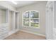Spacious walk-in closet featuring built-in shelves, drawers, and ample hanging space and natural light at 31754 Red Tail Blvd, Sorrento, FL 32776