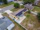Aerial view of home featuring solar panels, fenced yard and surrounding neighborhood at 3300 Needles Dr, Orlando, FL 32810