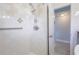 Bright bathroom featuring a shower and an open doorway, adding a touch of convenience to the space at 3300 Needles Dr, Orlando, FL 32810