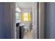 Bright bathroom with a sink, toilet, and bathtub/shower combination with yellow curtains at 3300 Needles Dr, Orlando, FL 32810