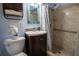 A tiled bathroom is complemented by a vanity, toilet, and shower, providing a clean and functional space at 3300 Needles Dr, Orlando, FL 32810