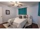 This cozy bedroom features soft lighting, a comfortable bed, and modern curtains, creating a relaxing atmosphere at 3300 Needles Dr, Orlando, FL 32810