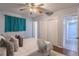 Serene bedroom with a large bed, wood floor, closet and ensuite bathroom, offering comfort and practicality at 3300 Needles Dr, Orlando, FL 32810