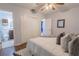 Relaxing bedroom featuring a large bed, closet, and attached bathroom for added convenience at 3300 Needles Dr, Orlando, FL 32810