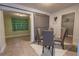 Dining area showcasing a glass table, upholstered chairs, and a sliding barn door leading to an adjacent room at 3300 Needles Dr, Orlando, FL 32810