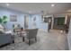 Inviting living room with tile flooring, neutral paint, and an open concept design to the kitchen at 3300 Needles Dr, Orlando, FL 32810